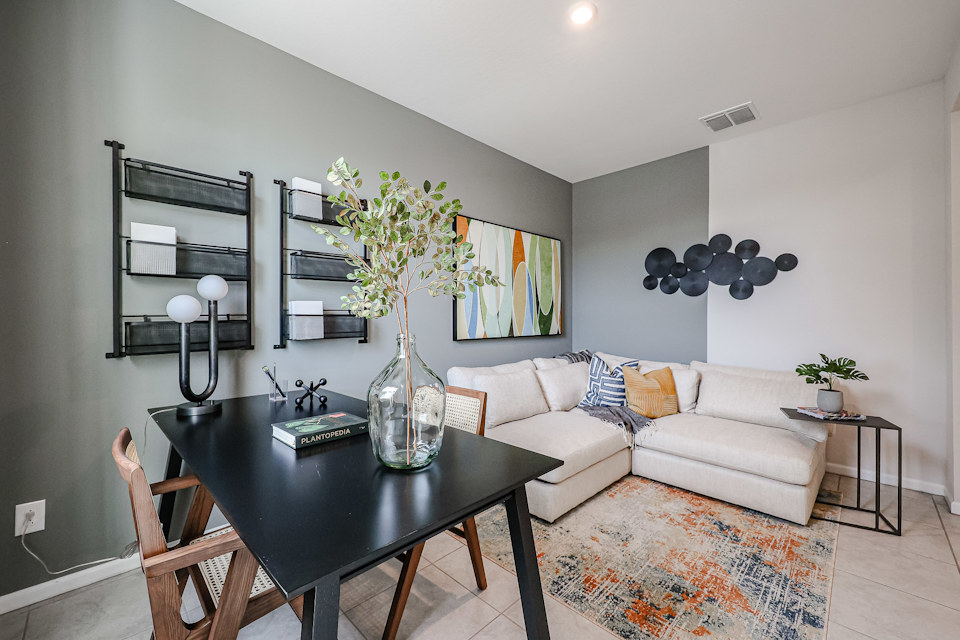 A living room with a couch and a table.