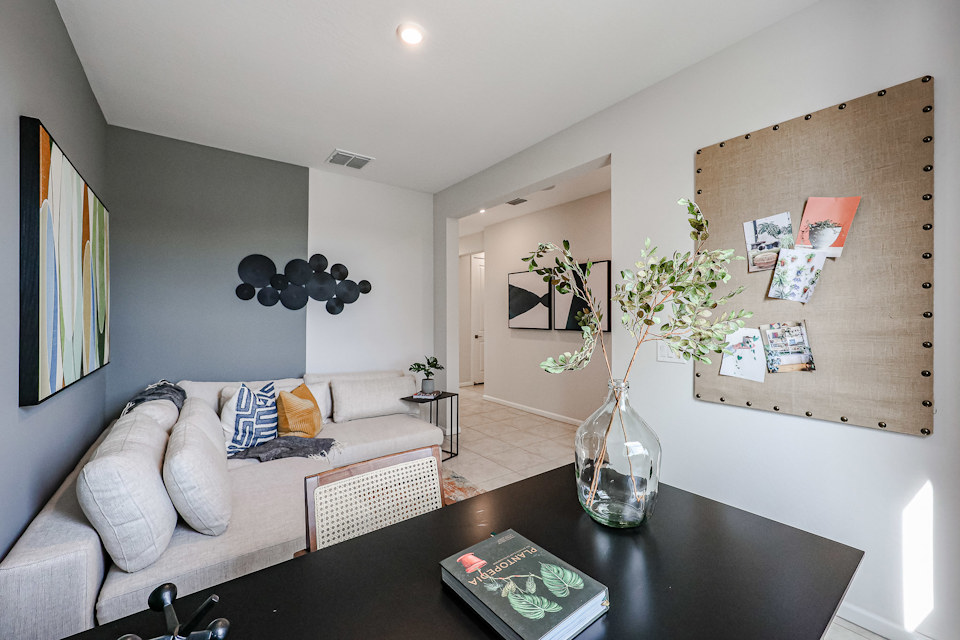 A living room with a couch and a table.