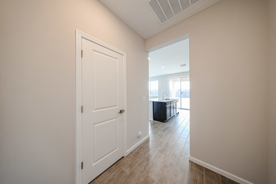 A hallway with white doors.