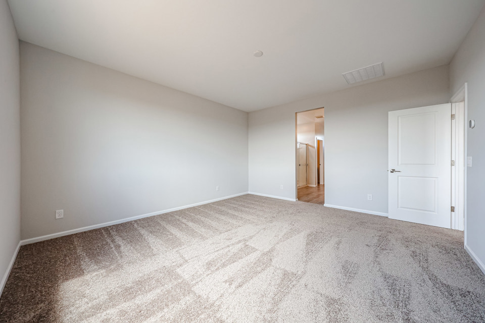 A hallway with white doors.
