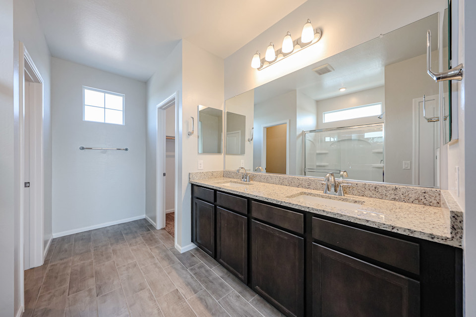 A bathroom with a marble countertop.