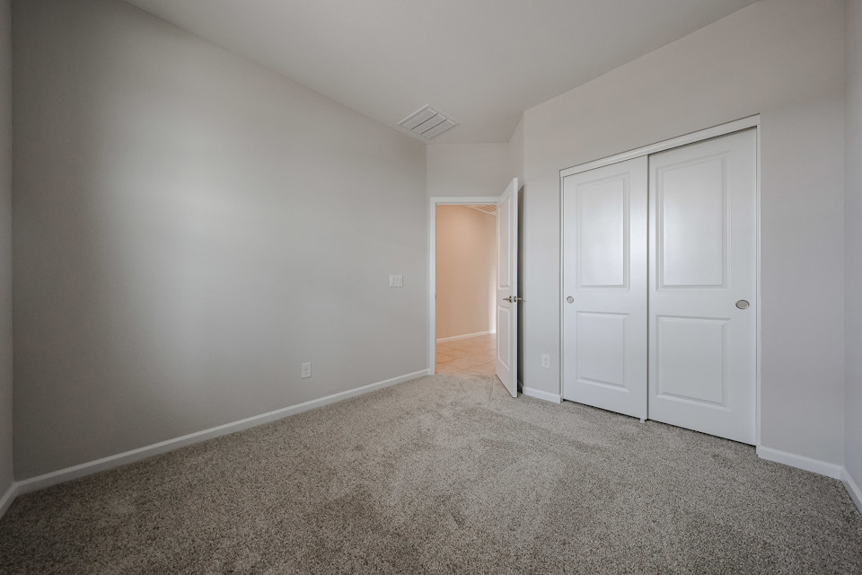 A hallway with white doors.