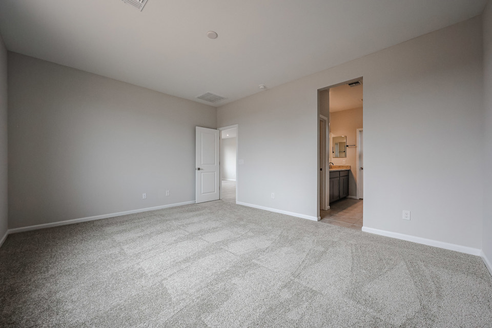 A hallway with white walls.