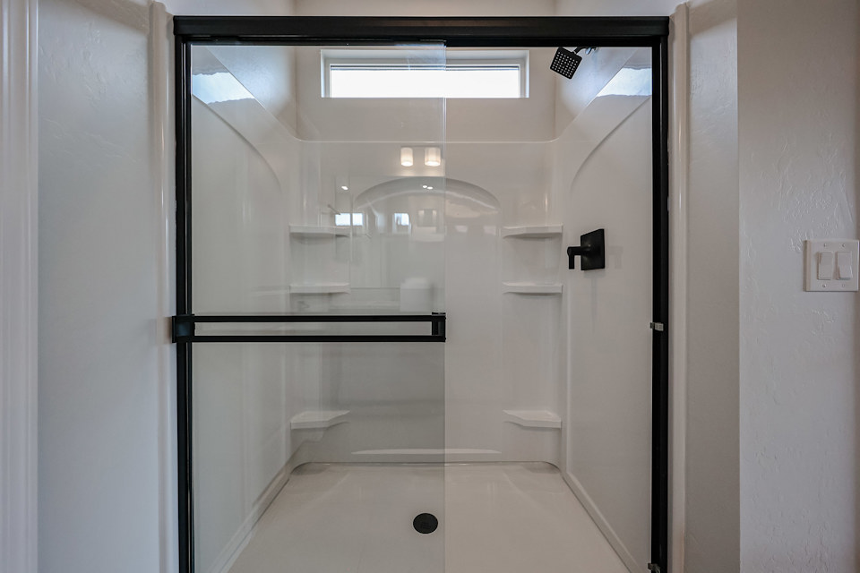 A bathroom with a glass shower.