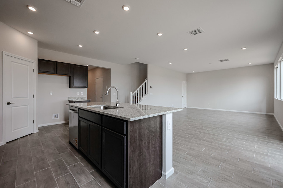 A kitchen with a marble countertop.