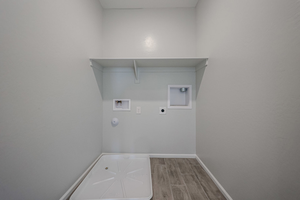 A white room with a tile floor.