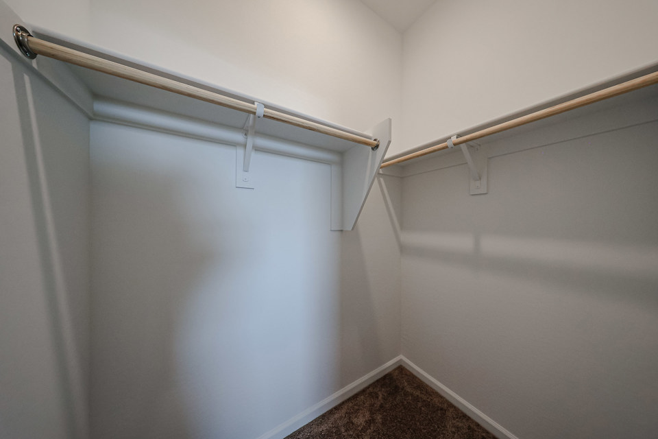 A metal bar on a white wall.