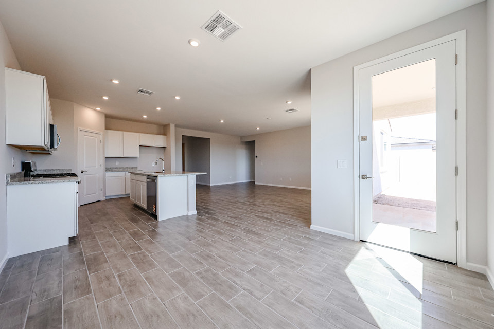 A large kitchen with white cabinets.