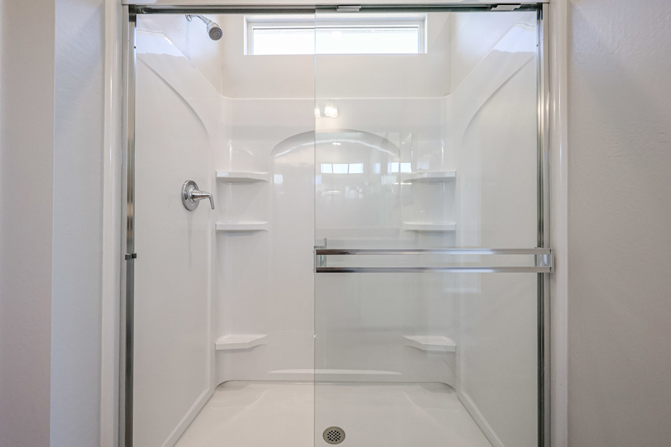 A bathroom with a glass shower.