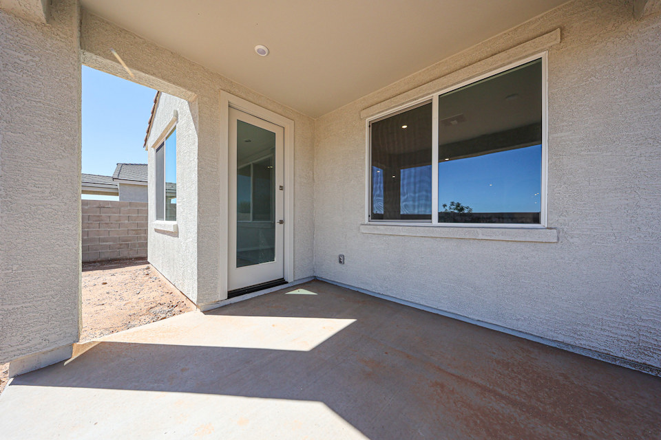 A room with a window and a door.