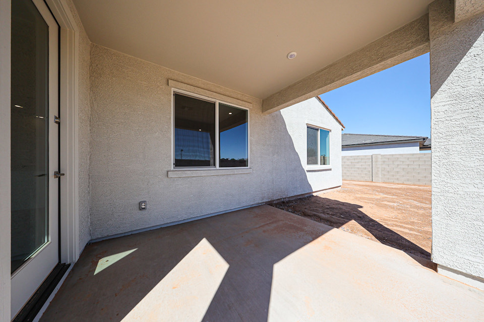 A room with a window and a door.