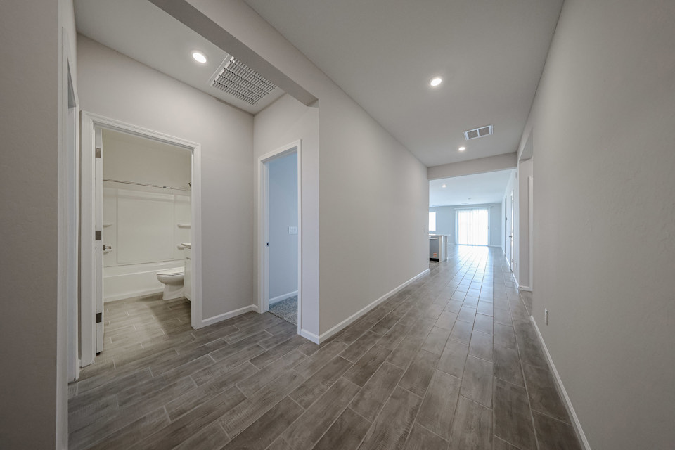 A bathroom with a wood floor.