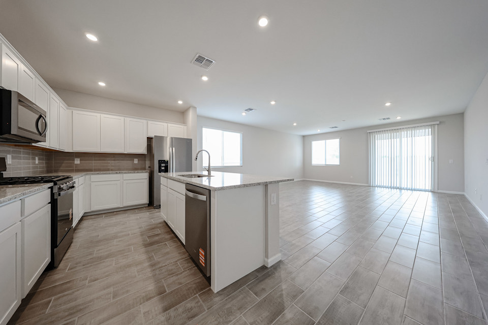 A kitchen with wooden floors.