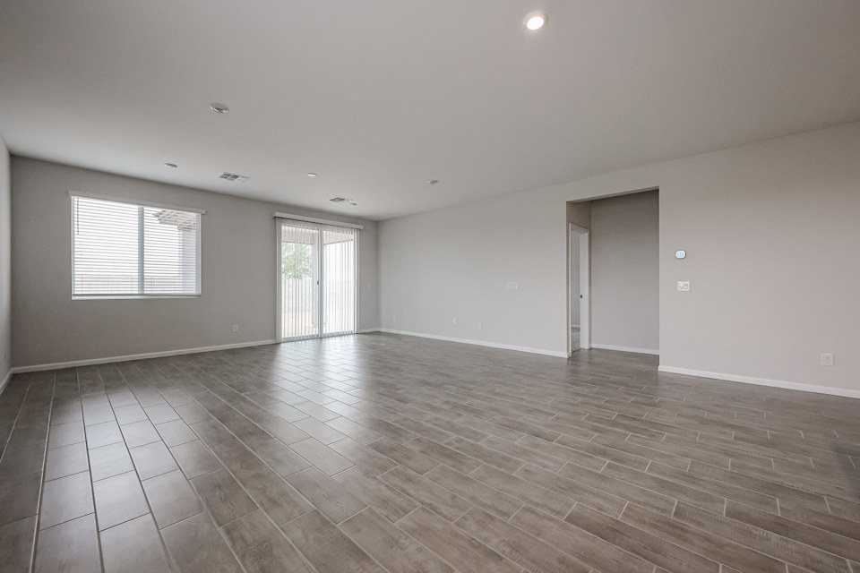 A room with a wood floor and a wood floor.