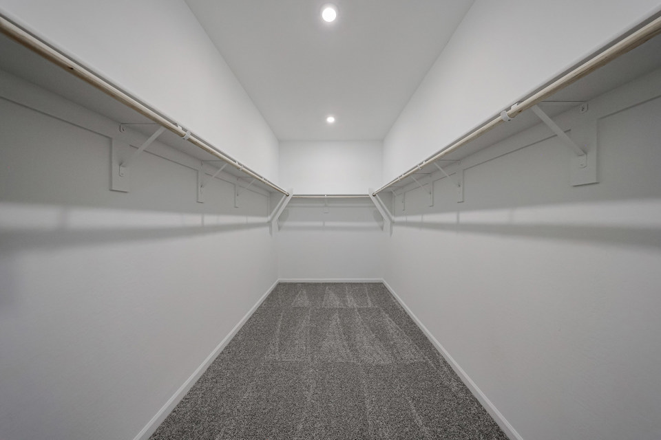 A hallway with white walls.