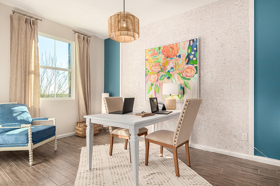 A room with a table and chairs.