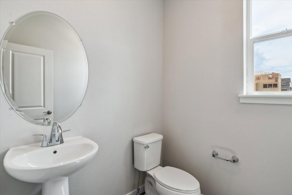 A bathroom with a sink and a mirror.