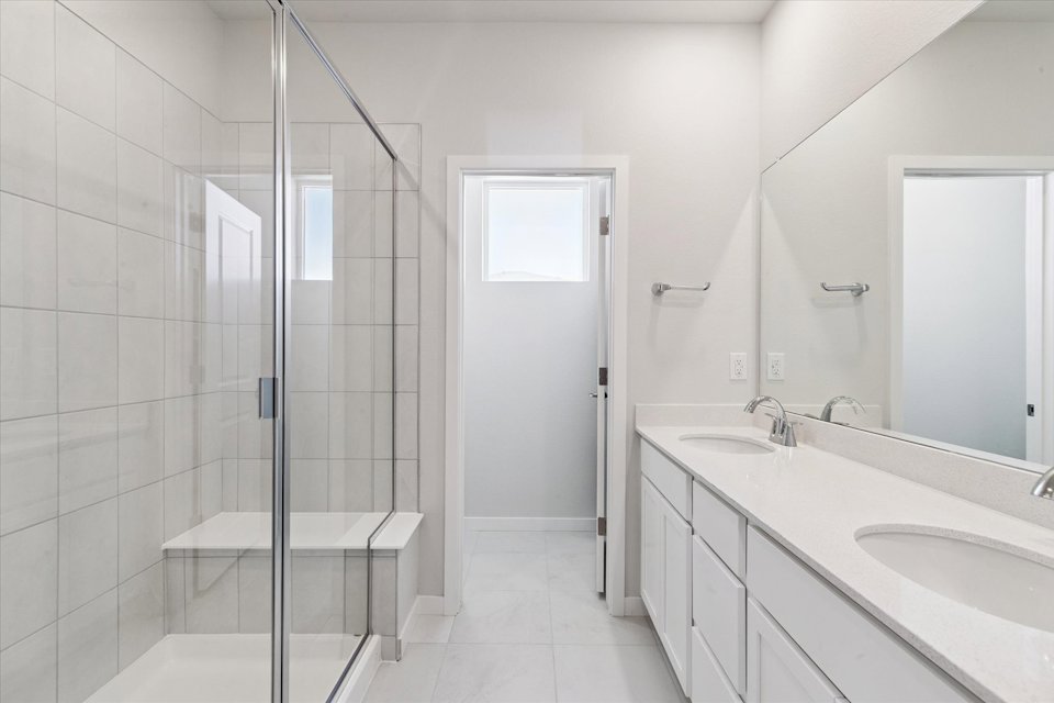 A bathroom with a glass shower.
