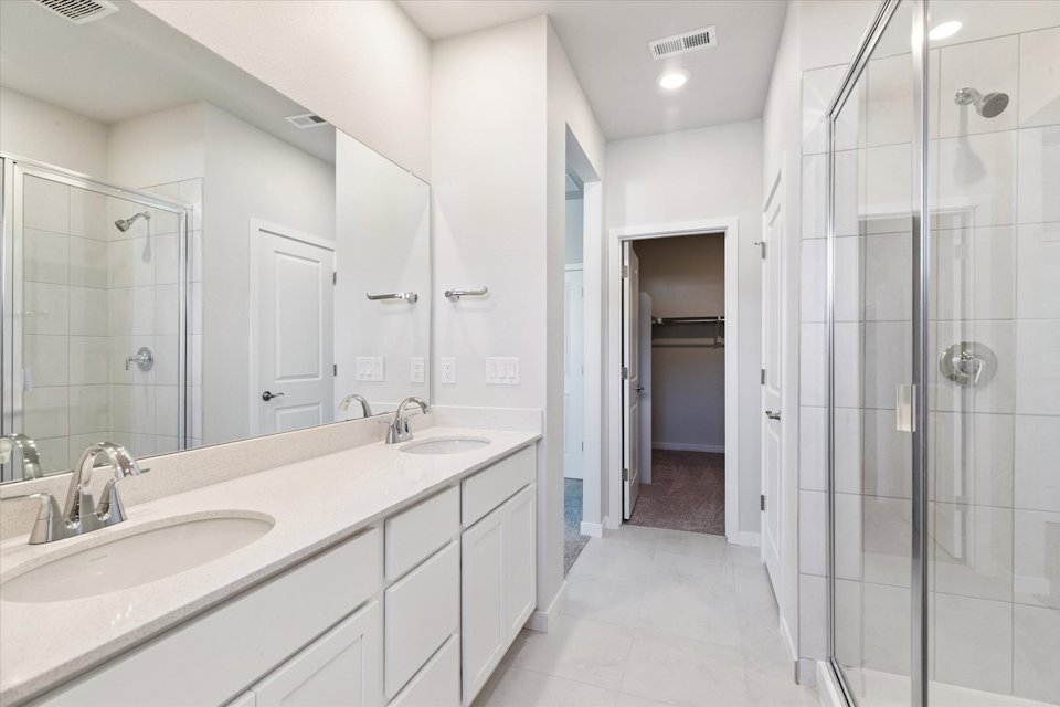A bathroom with a glass shower.