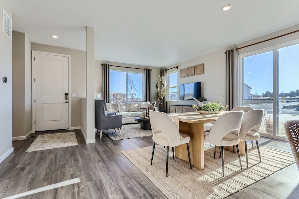 A dining room with a large window.