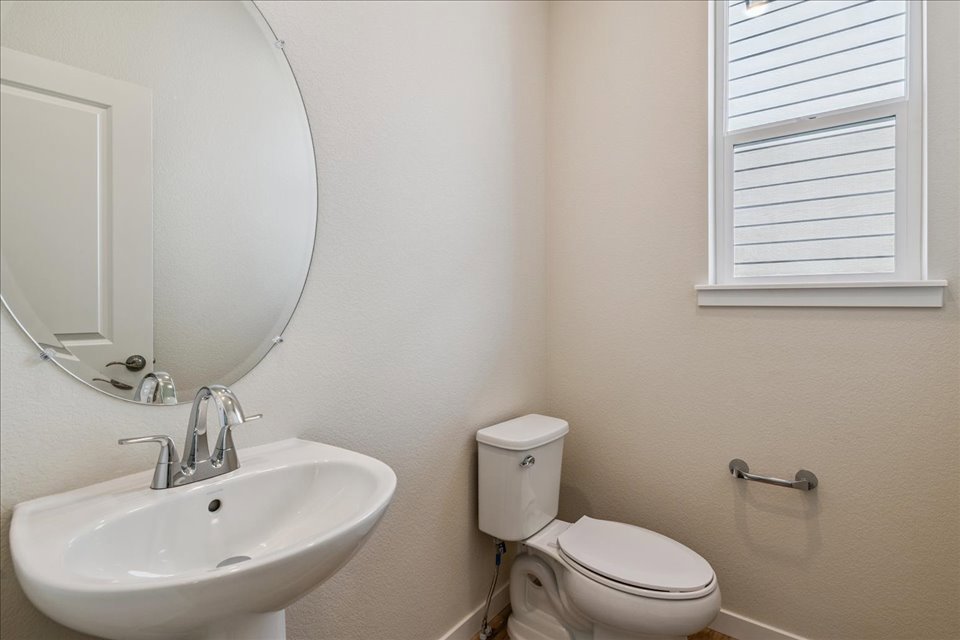 A bathroom with a sink and toilet.