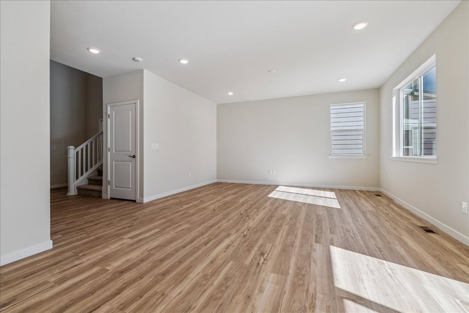 A room with a wood floor and a wood floor.