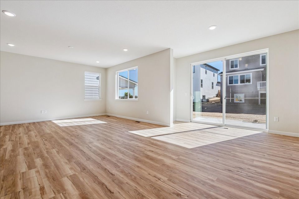 A room with a wood floor and a wood floor.