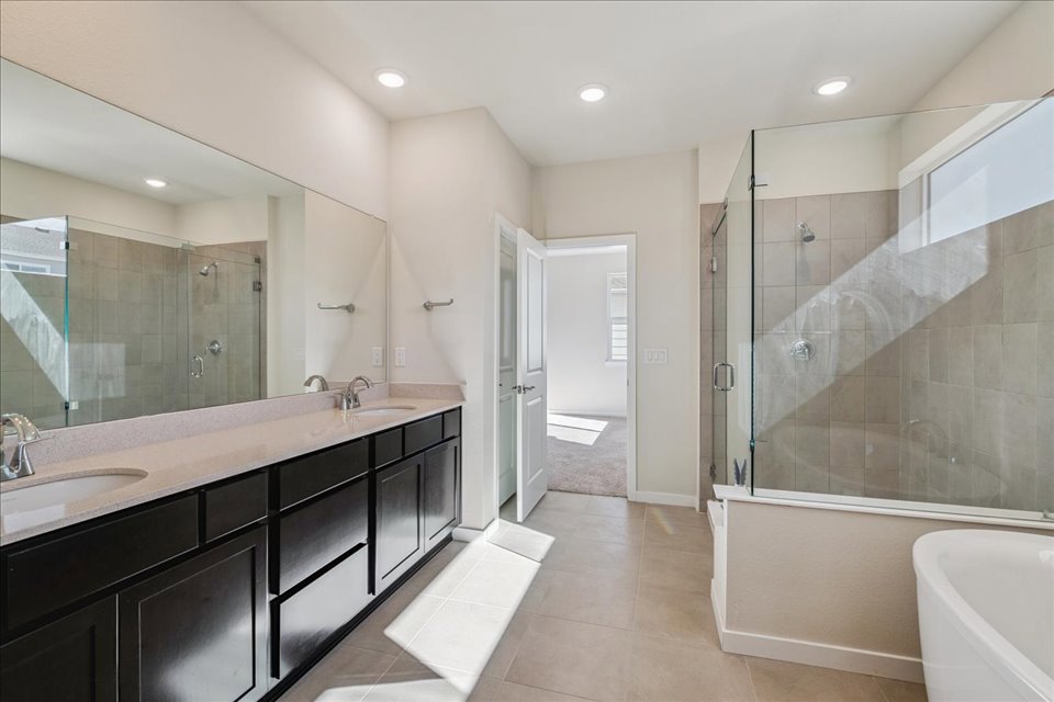A bathroom with a large glass shower.
