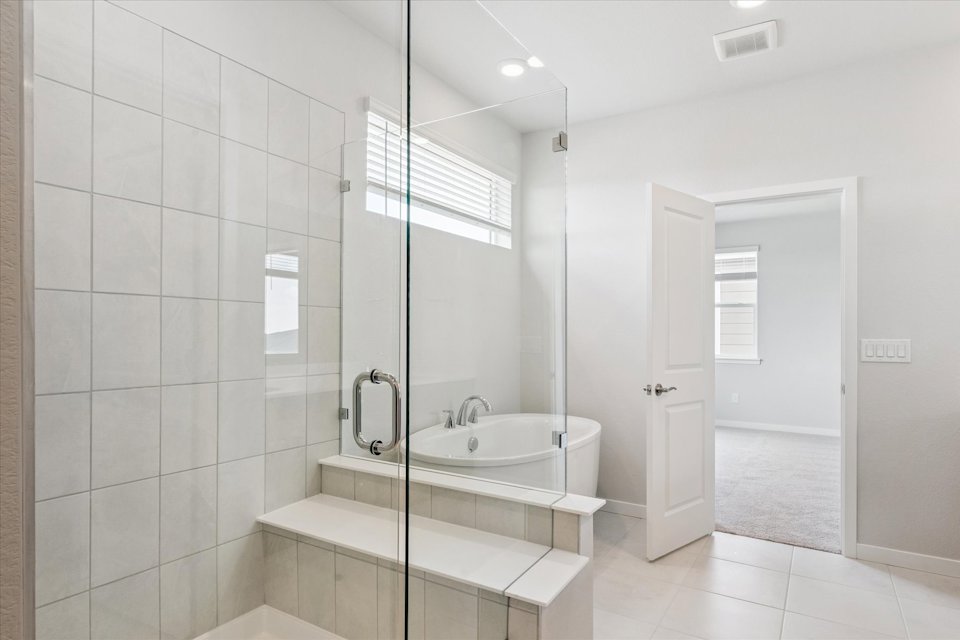 A bathroom with a glass shower.