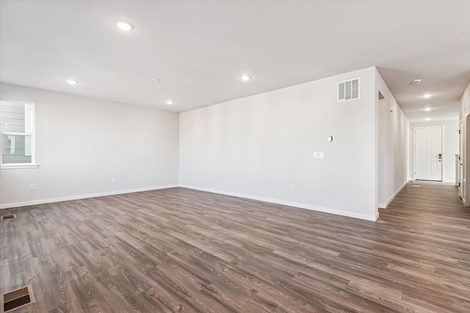 A room with a wood floor and a wood floor.