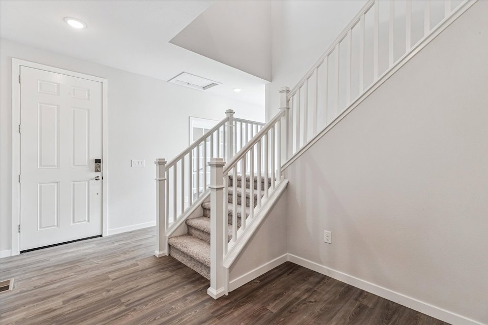A white staircase in a house.
