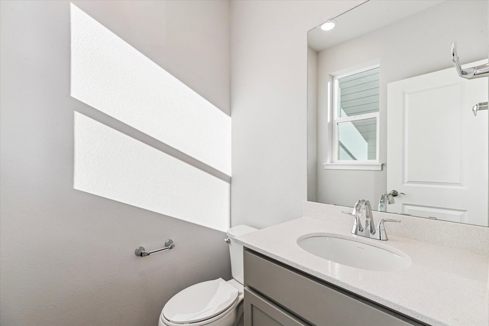 A bathroom with a sink and a toilet.