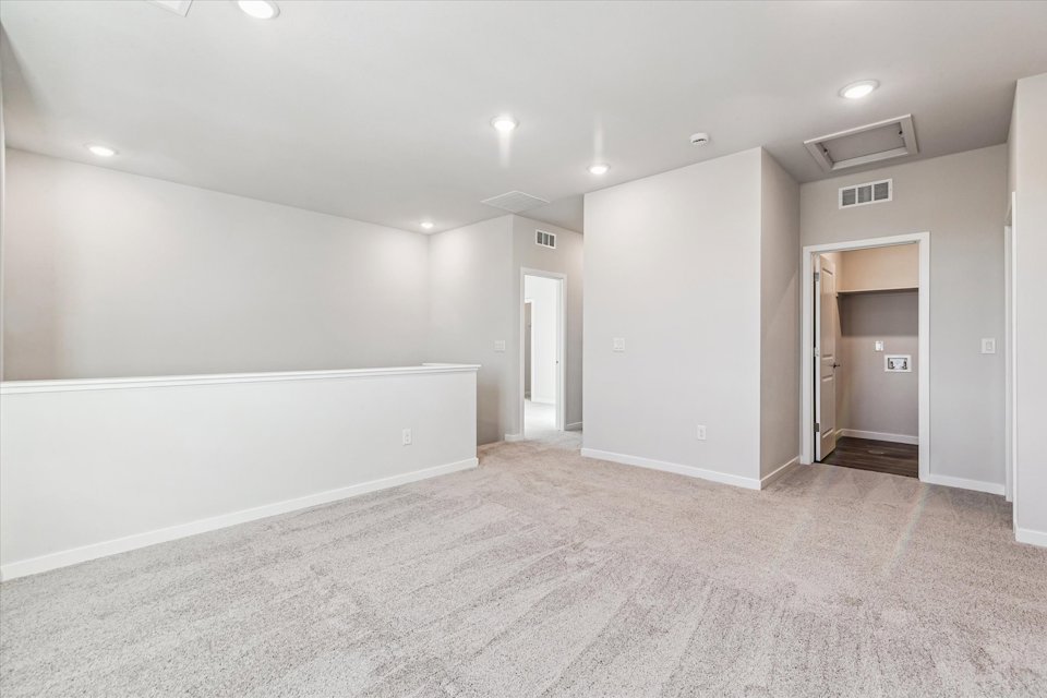 A hallway with white walls.