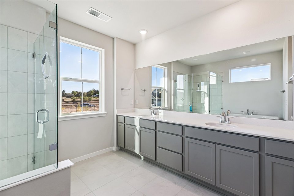 A bathroom with a large glass shower.