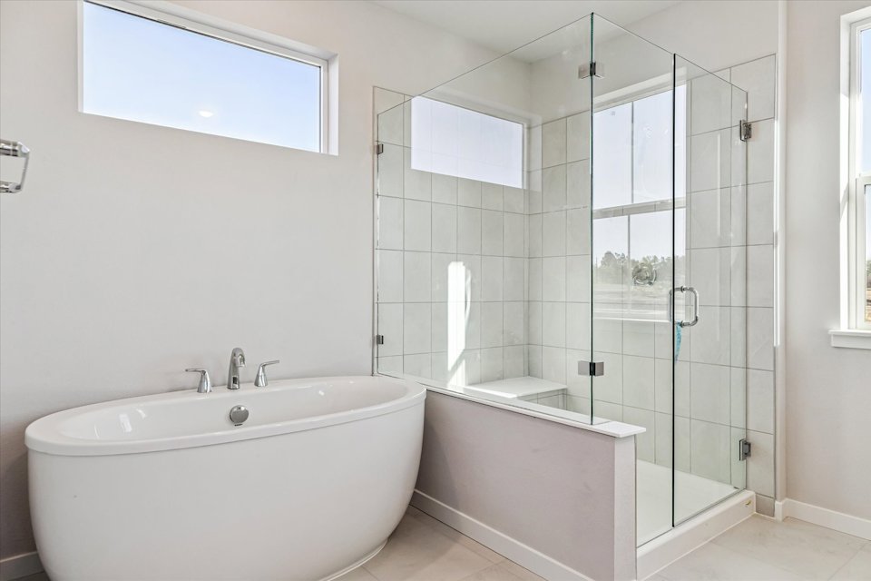 A bathroom with a glass shower.