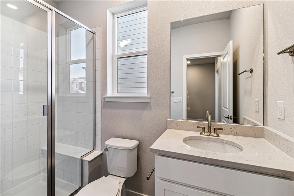 A bathroom with a glass shower.