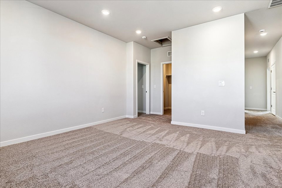 A hallway with white walls.