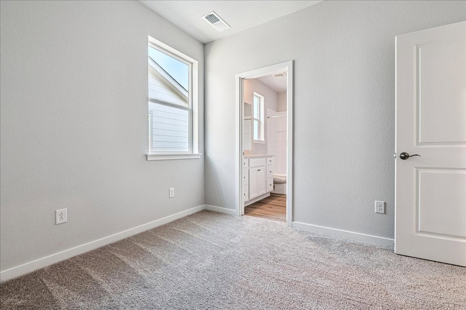 A room with a door and a window.