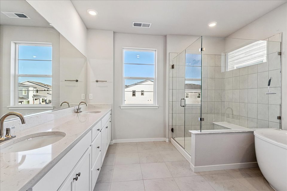 A bathroom with a glass shower.