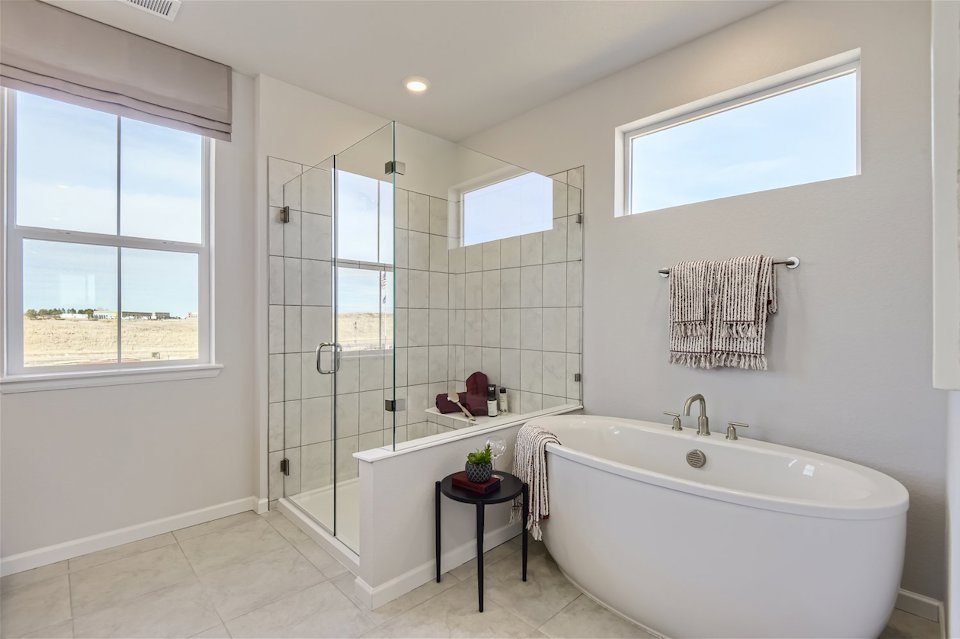 A bathroom with a tub and sink.