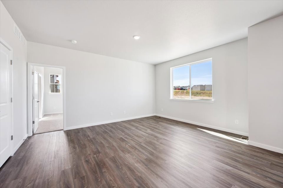 A room with a wood floor and a wood floor.