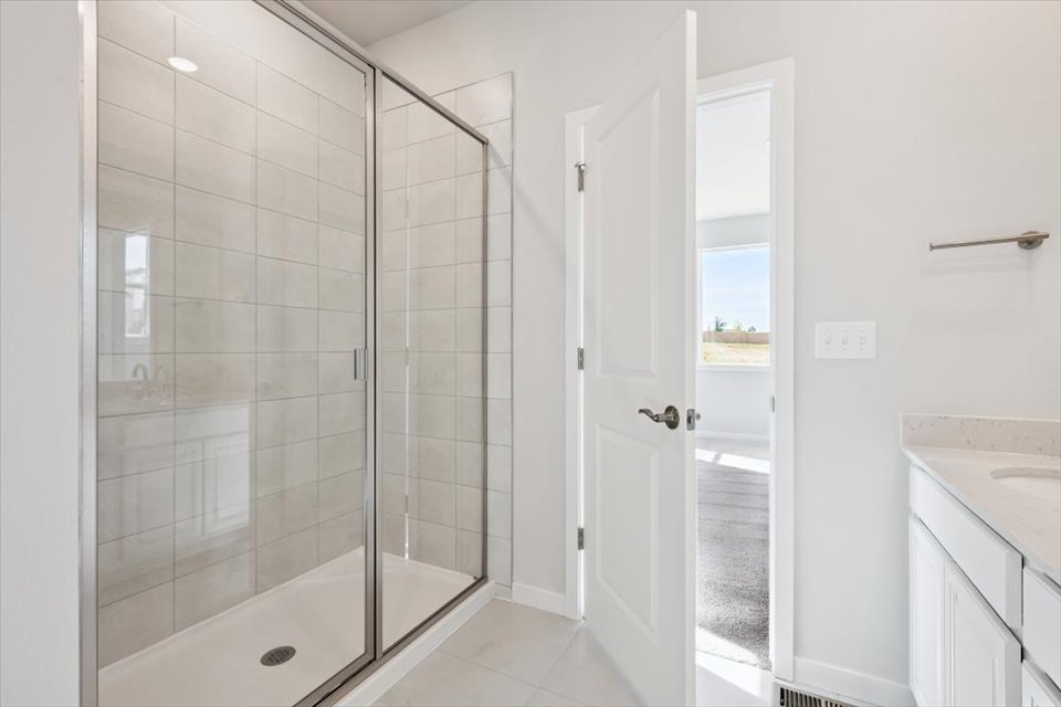 A bathroom with a glass shower.