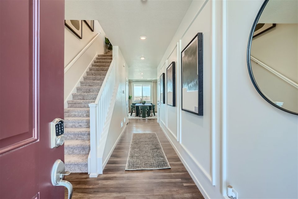A hallway with a wood floor.