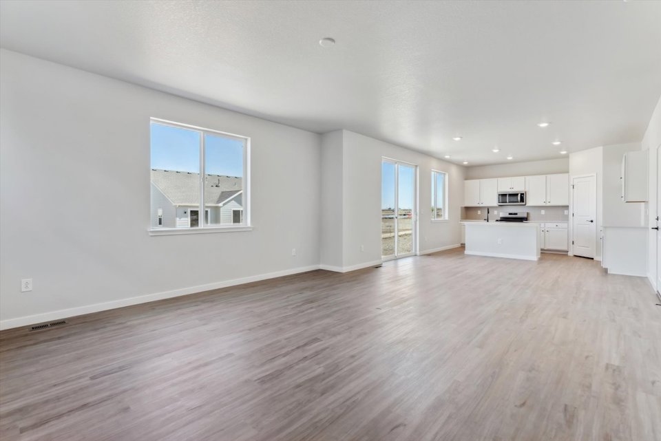 A large empty room with white walls.