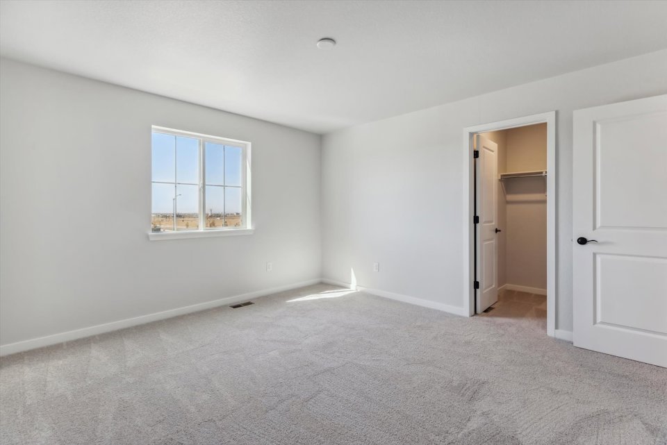 A room with a door and a window.