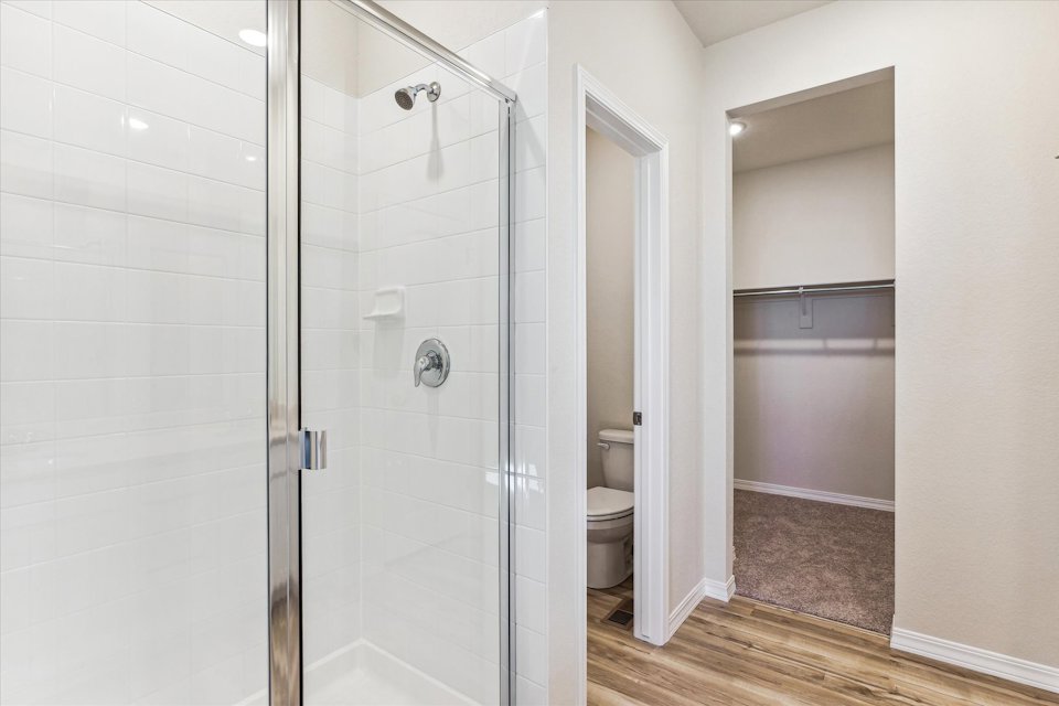 A bathroom with a glass shower.