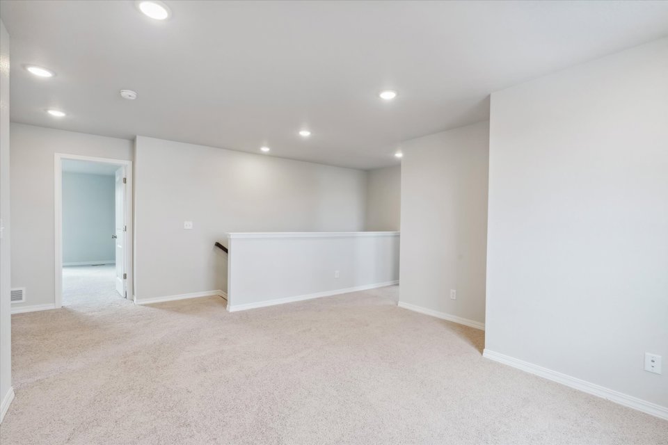 A room with a white wall and a white floor.