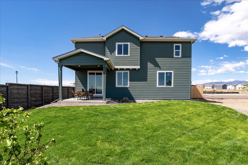 A house with a grass yard.