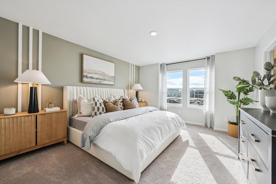 A bedroom with a large bed.