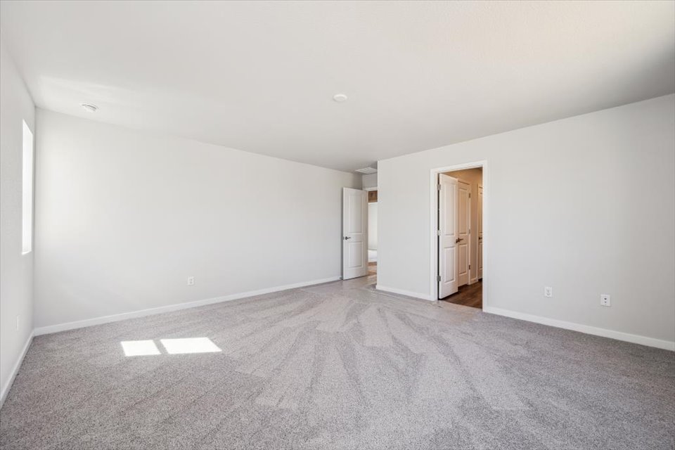 A hallway with white walls.
